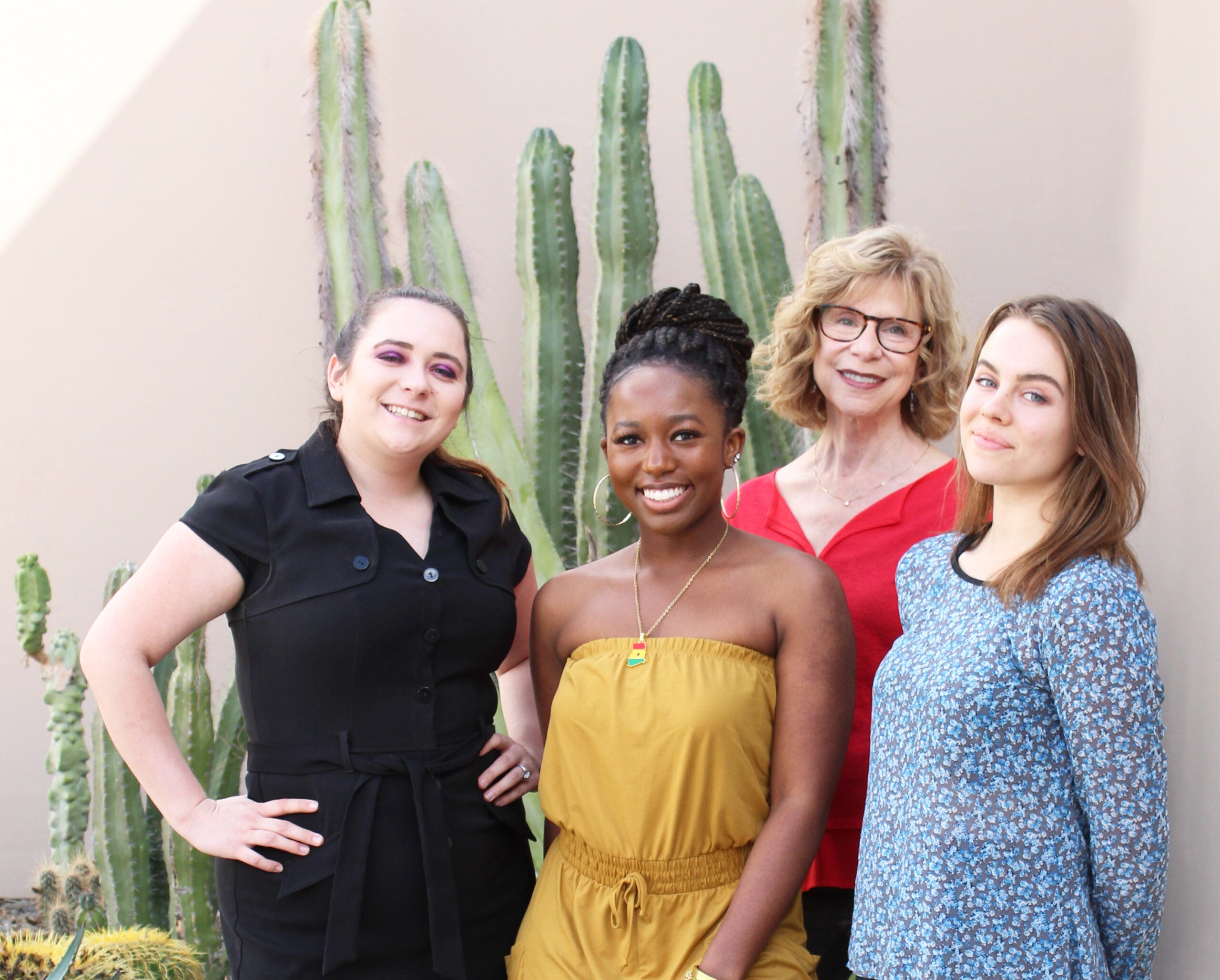 3 students and their faculty member for the Beyond the Lab program